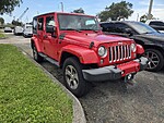 Used 2018 JEEP WRANGLER JK UNLIMITED SAHARA in WEST PALM BEACH, FLORIDA (Photo 1)