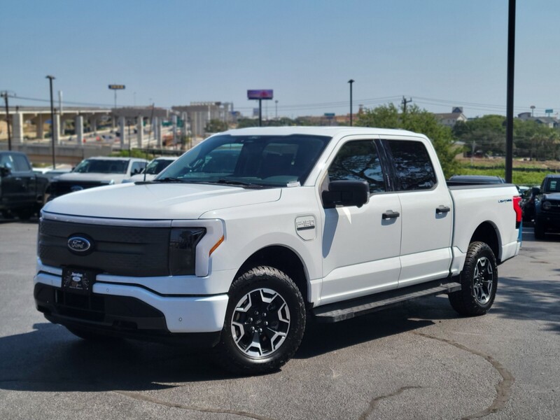 Used 2022 Ford F-150 Lightning XLT with VIN 1FT6W1EV4NWG08322 for sale in Live Oak, TX